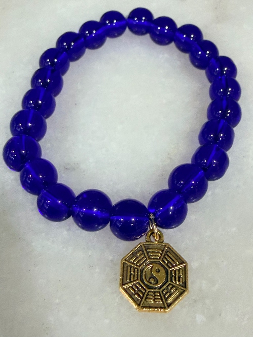 Cobalt Blue Bead Bracelet With Gold Yin Yang Charm